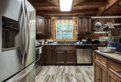 Whispering Winds fully furnished kitchen with granite countertops