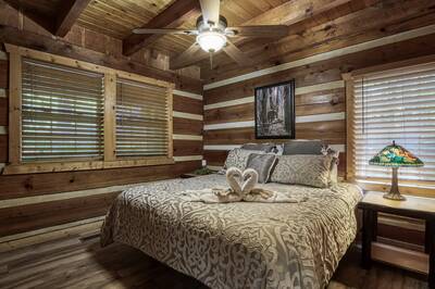 Whispering Winds main level bedroom with king size bed