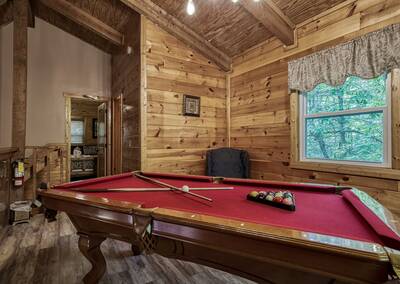Whispering Winds upper level loft area with pool table