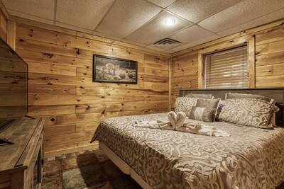 Whispering Winds lower level bedroom with king size bed