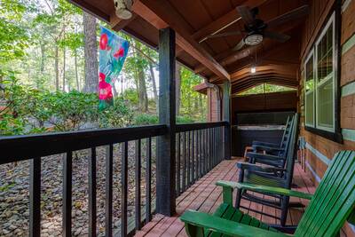 Whispering Winds covered entry deck with rocking chairs
