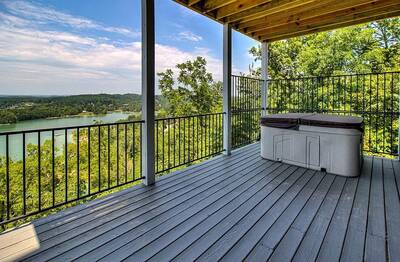 Lake View Therapy covered back deck with hot tub