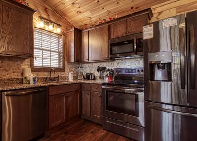 The Road Less Traveled fully furnished kitchen with granite countertops