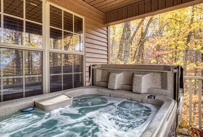 The Road Less Traveled covered deck with hot tub