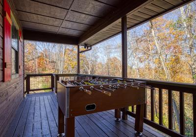 Margaritas at Sunrise covered deck with foosball table