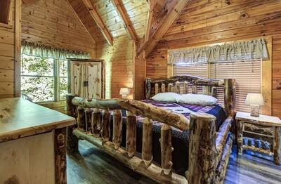 Creekview upper level bedroom with king size bed