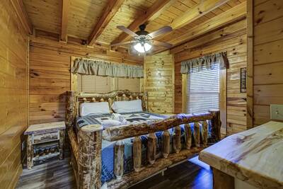 Creekview main level bedroom with king size bed
