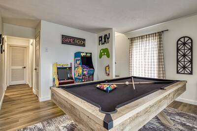 Peak of Perfection game room with arcade machines