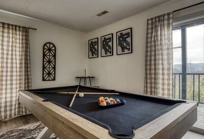 Peak of Perfection game room with pool table