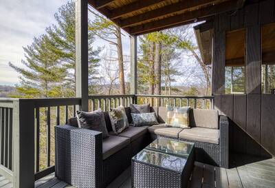 Peak of Perfection covered back deck with outdoor couches