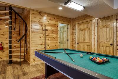 Magic Views lower level game room with pool table