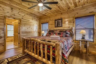 Cozy Cub Cabin main level bedroom with king size bed