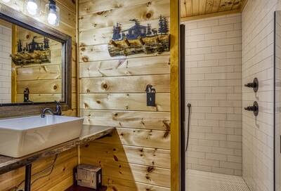 Cozy Cub Cabin upper level bathroom with walk in shower