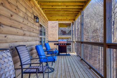 Singing in the Smokies main level covered back deck with gas grill