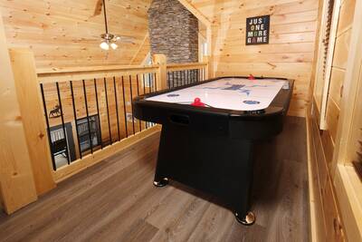 Pine View Lodge upper level loft area air hockey table