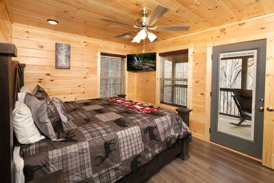 Pine View Lodge upper level bedroom with king bed and private balcony