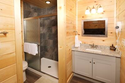 Pine View Lodge upper level bathroom with single vanity and walk in shower
