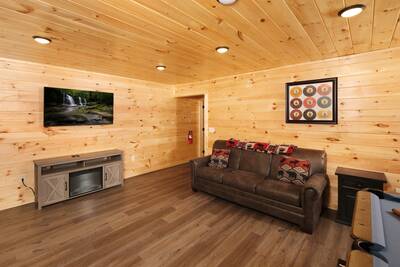 Pine View Lodge lower level game room with year round electric fireplace