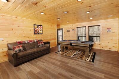Pine View Lodge lower level game room with sleeper sofa