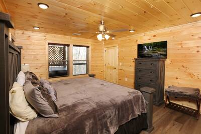 Pine View Lodge lower level bedroom with king bed and 43 inch TV