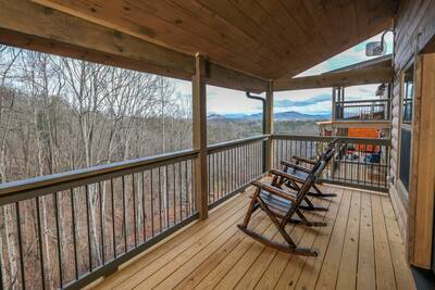 Pine View Lodge upper level deck with rocking chairs