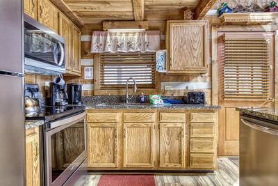 Old Glory fully furnished kitchen with stainless steel appliances