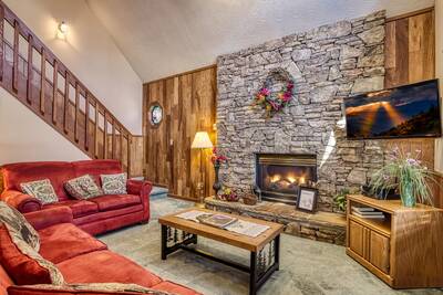Blackberry Ridge living room with stone encased gas fireplace