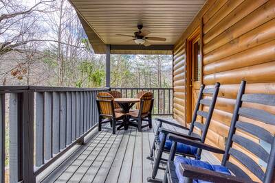 Lakeview covered back deck with rocking chairs