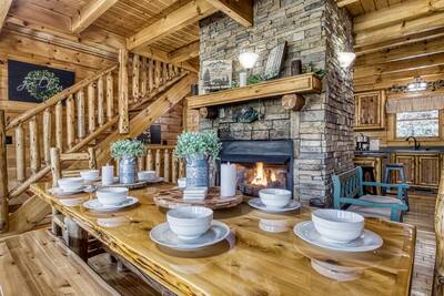 Katies Lodge dining table and gas fireplace