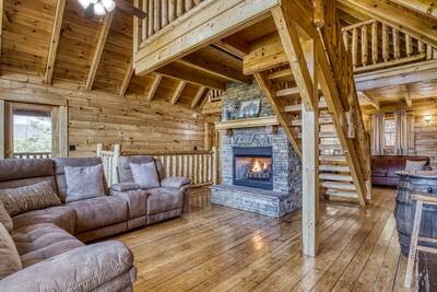 Katies Lodge upper level living room with seasonal gas fireplace