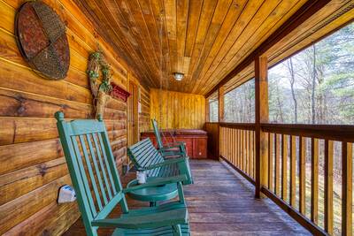 Walden Ridge Retreat covered back deck with rocking chair and swing