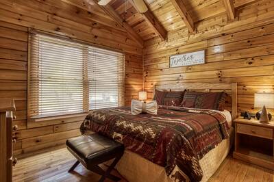 River Falls bedroom with a king size bed