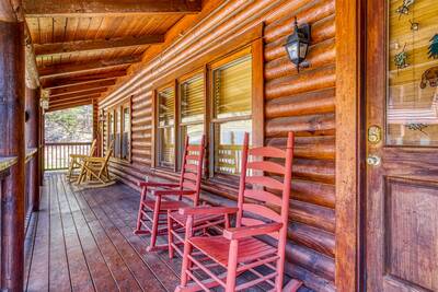 Another Day Inn Bearadise covered entry deck with rocking chairs