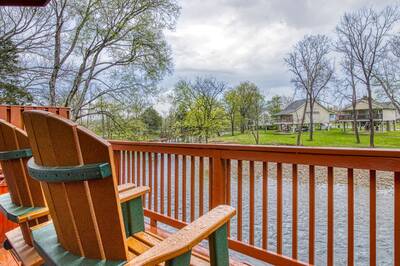 Down by the River back deck with Adirondack chairs