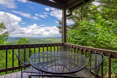 Awesome View covered deck with table and chairs