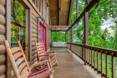 Awesome View covered back deck with rocking chairs