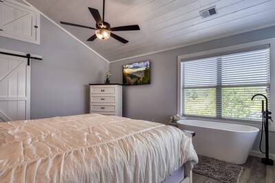 Lake View Therapy upper level bedroom with spa soaking tub