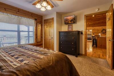 Getaway Mountain Lodge main level bedroom two with king size bed and 32 inch TV