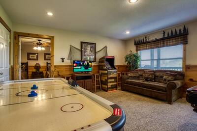 Getaway Mountain Lodge lower level game room with air hockey table and arcade machine