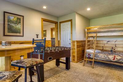 Getaway Mountain Lodge lower level game room with foosball table and bunk beds