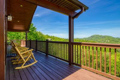 Getaway Mountain Lodge front deck with rocking chairs and mountain views