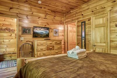 Antler Run main level bedroom two with king size bed and flat screen TV