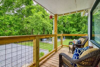 River View covered entry deck with rocking chairs