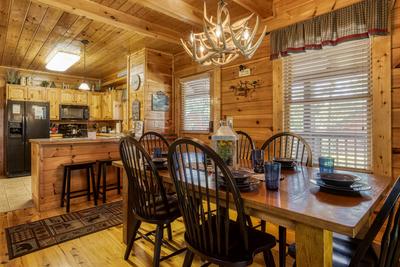 A Stone's Throw dining table and fully furnished kitchen