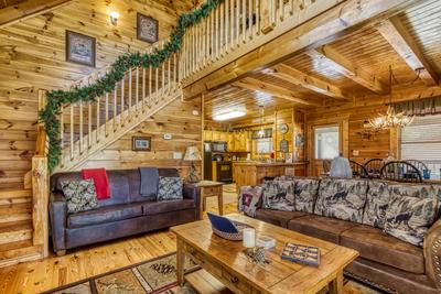 A Stone's Throw living room, kitchen, and loft area