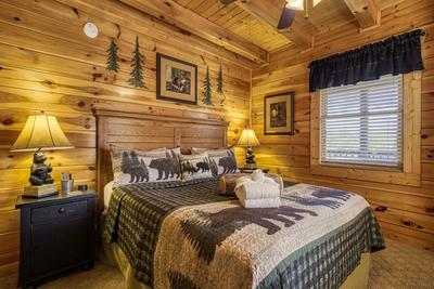 A Stone's Throw main level bedroom with king size bed