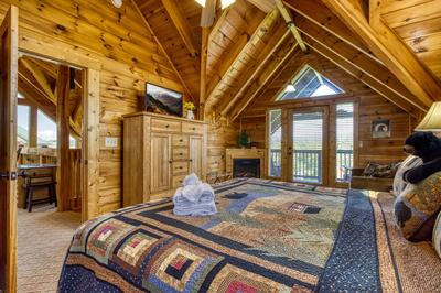 A Stone's Throw upper level bedroom with king size bed and private balcony