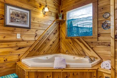 A Stone's Throw upper level bedroom with en suite jacuzzi