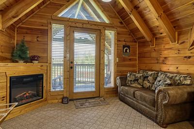 A Stone's Throw upper level bedroom sitting area with year round electric fireplace