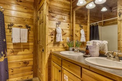 A Stone's Throw upper level bathroom with walk in shower and double vanity